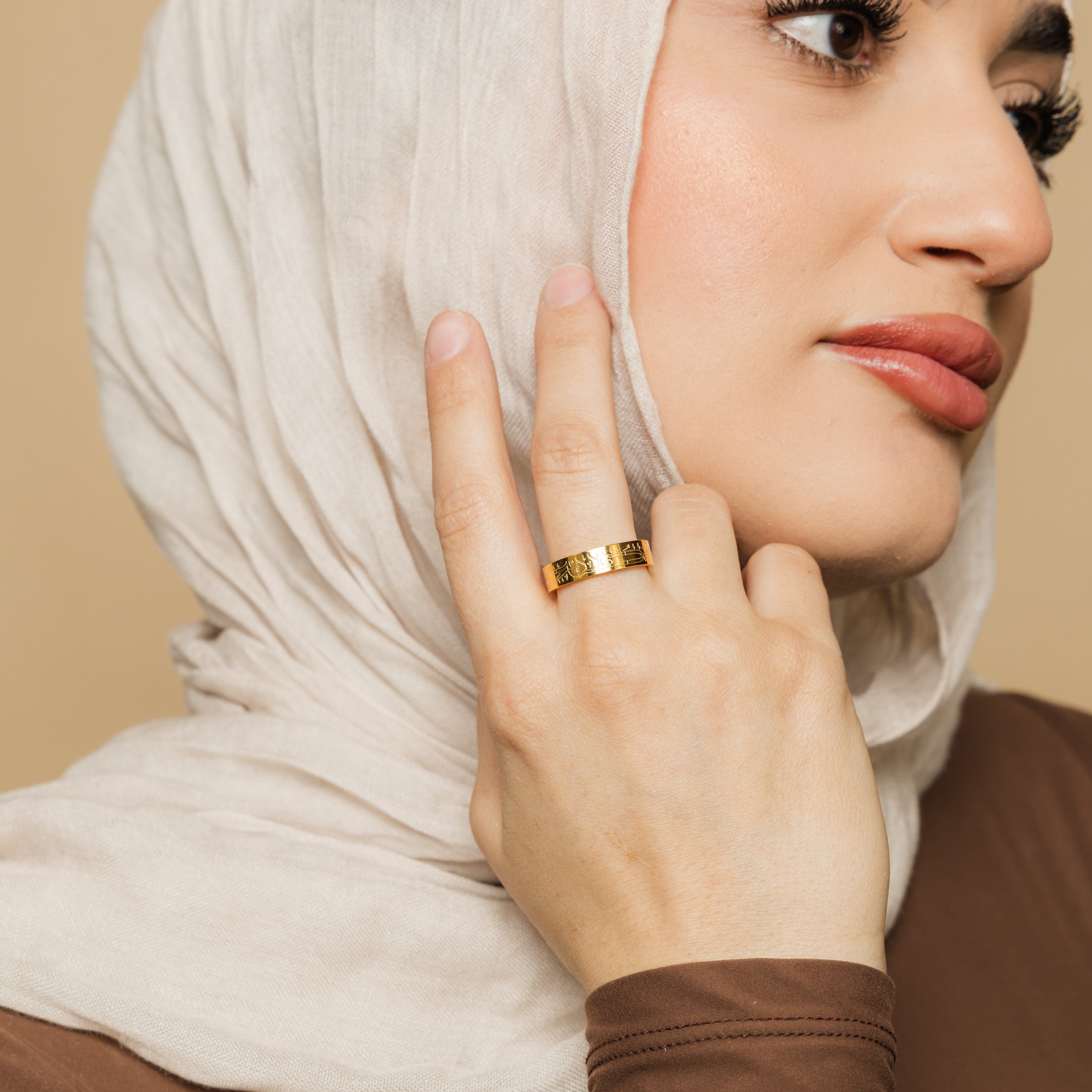 Model wearing womens calligraphy ring with engraved design, showcasing versatile everyday styling