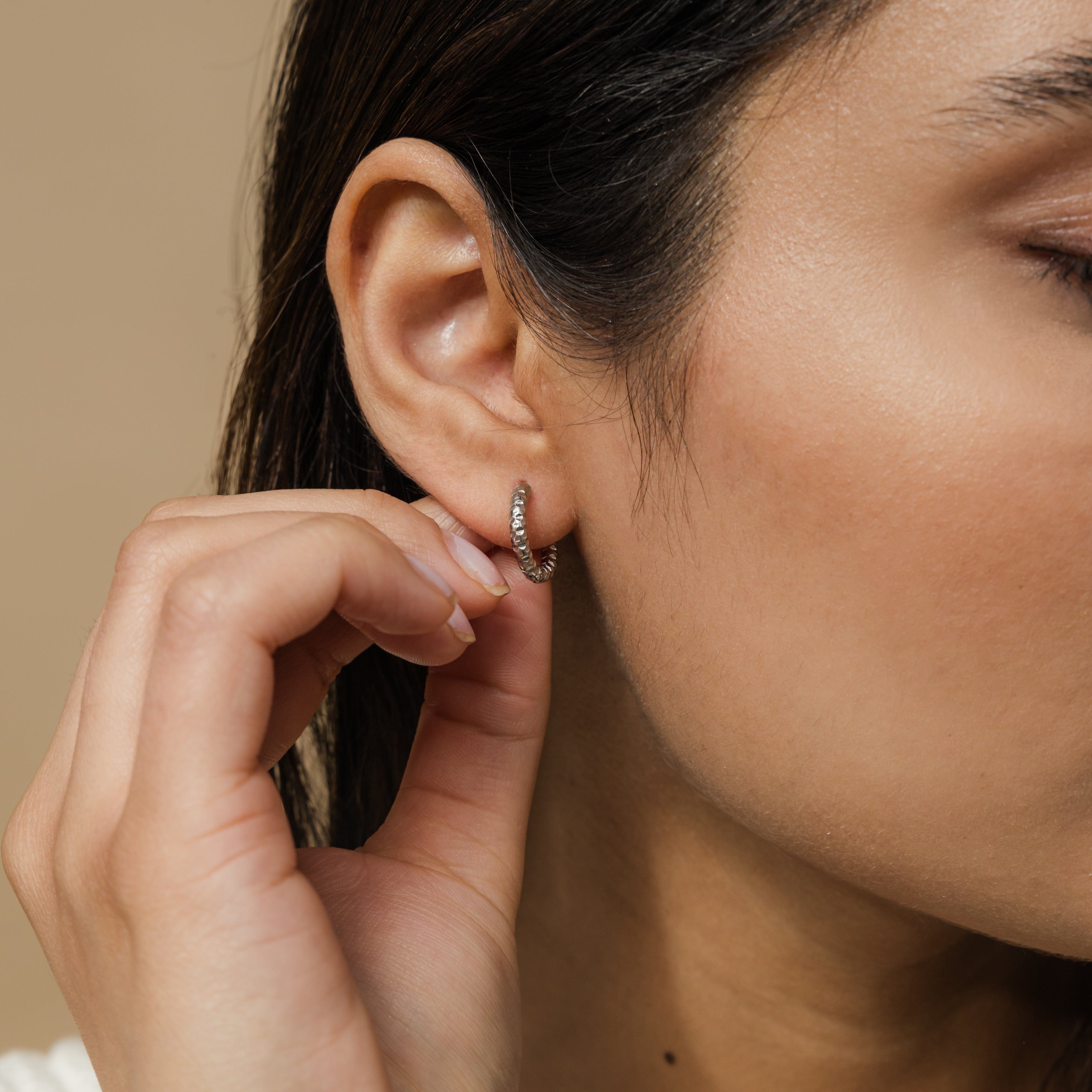 Vintage Glow Gold Hoops displayed in a velvet pouch, highlighting their elegant design.