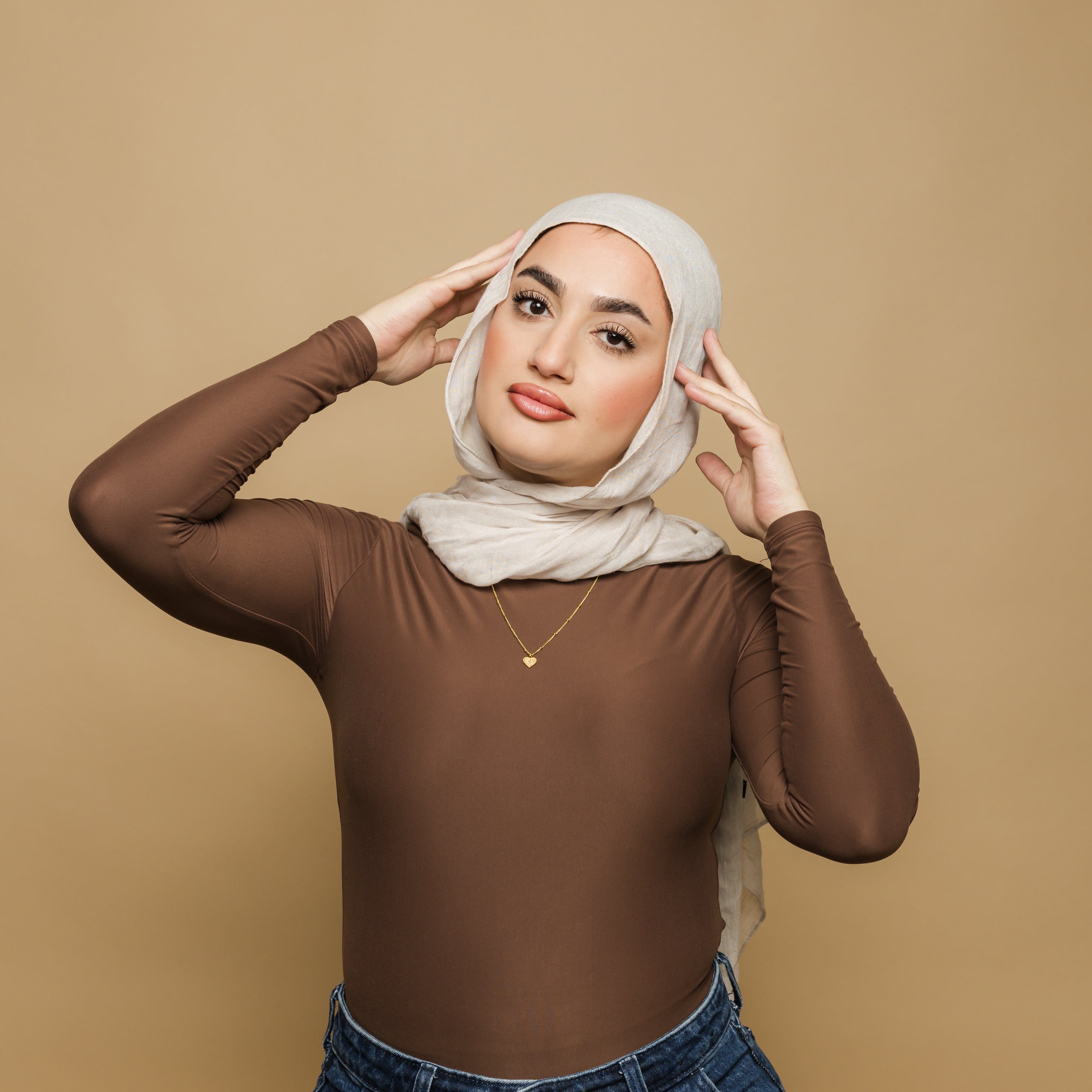 Model wearing heart pendant necklace for sisters, highlighting its elegance.