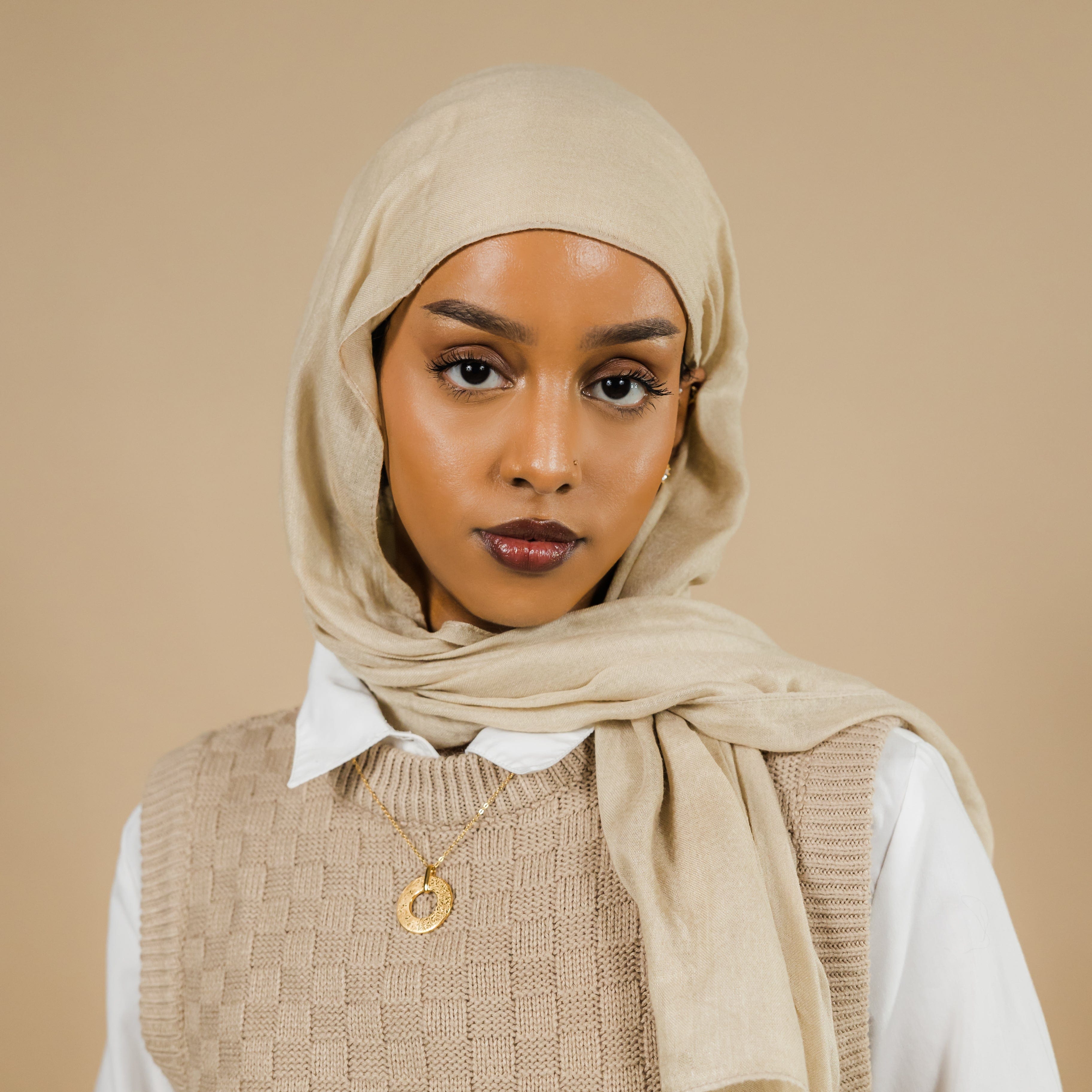 Dream Bloom Necklace showcasing the intricate olive leaves and Arabic engraving, perfect for women who love unique poetic jewelry.