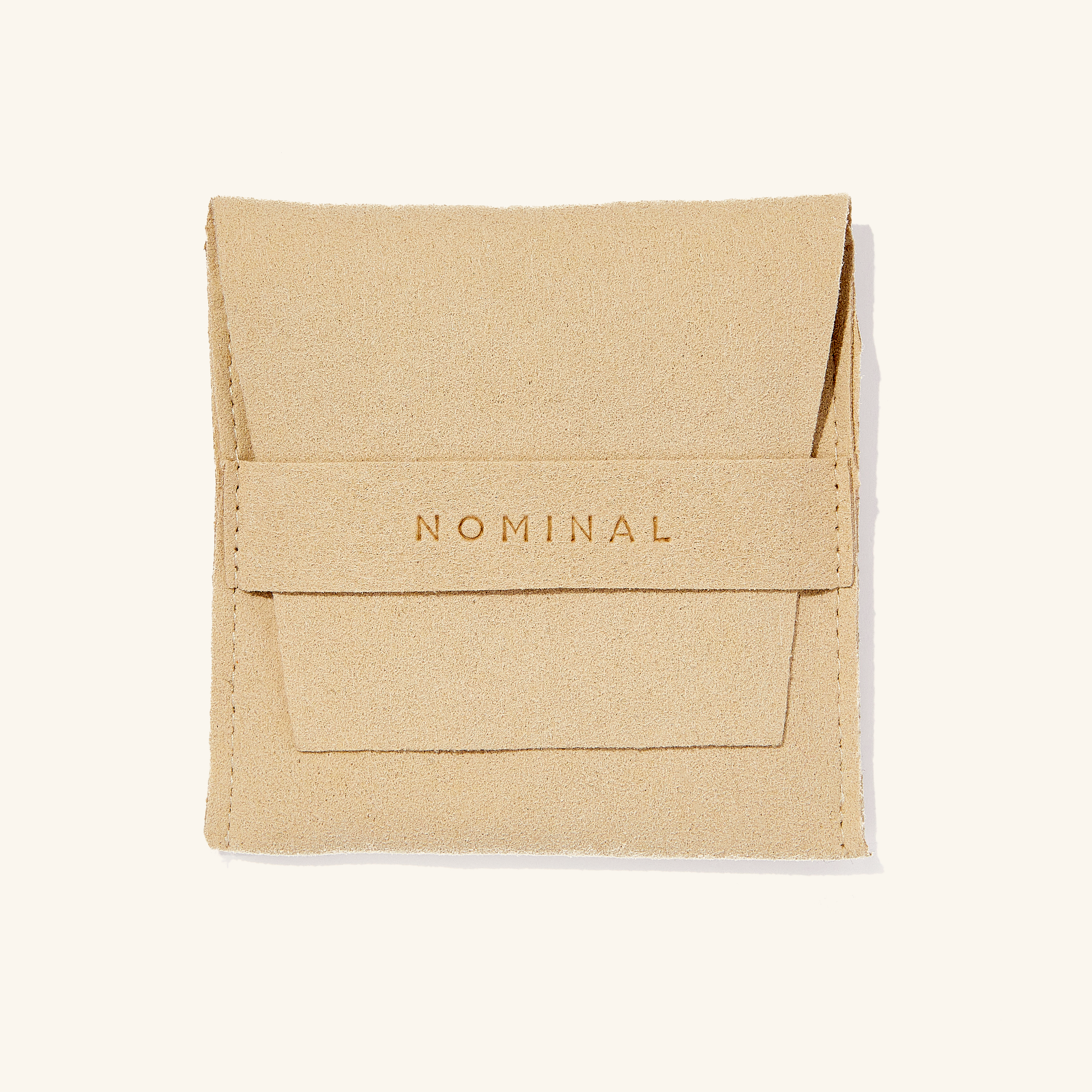 Gleaming Flutter Gold Chain Bracelet displayed on a velvet pouch, emphasizing its premium quality.