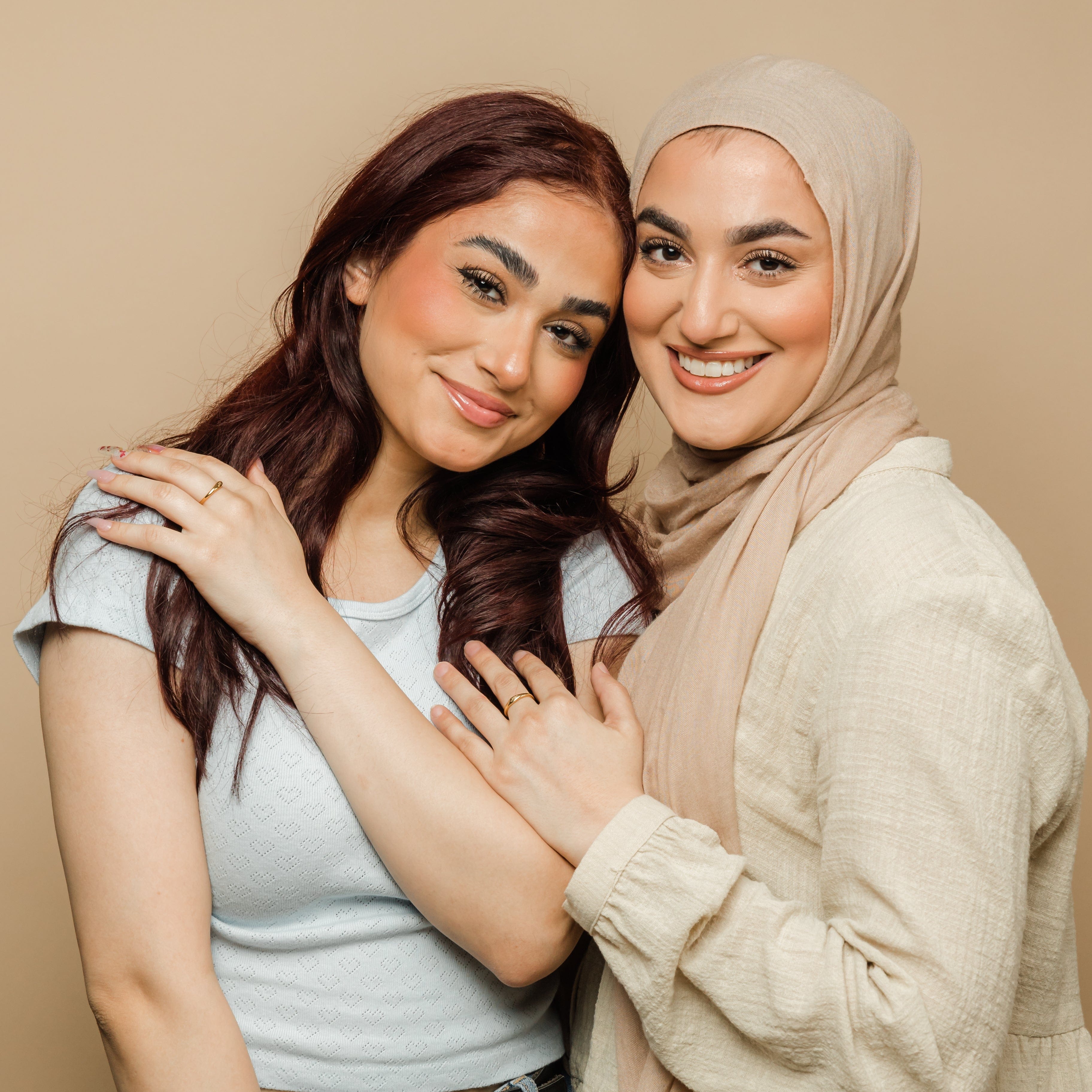Two sister rings stacked together, highlighting their meaningful connection.