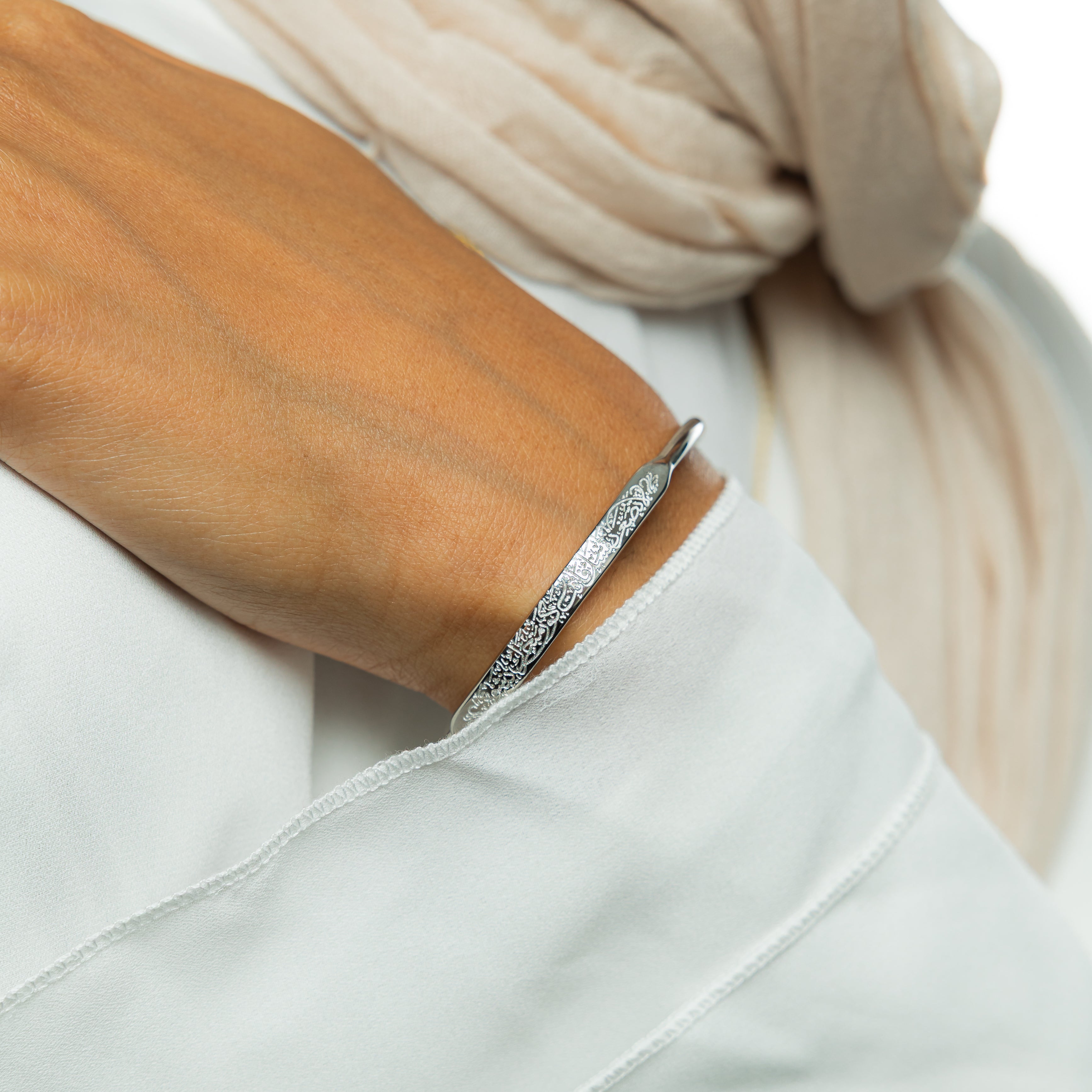 Rumi motivational bracelet worn on a wrist, showcasing its elegant style.