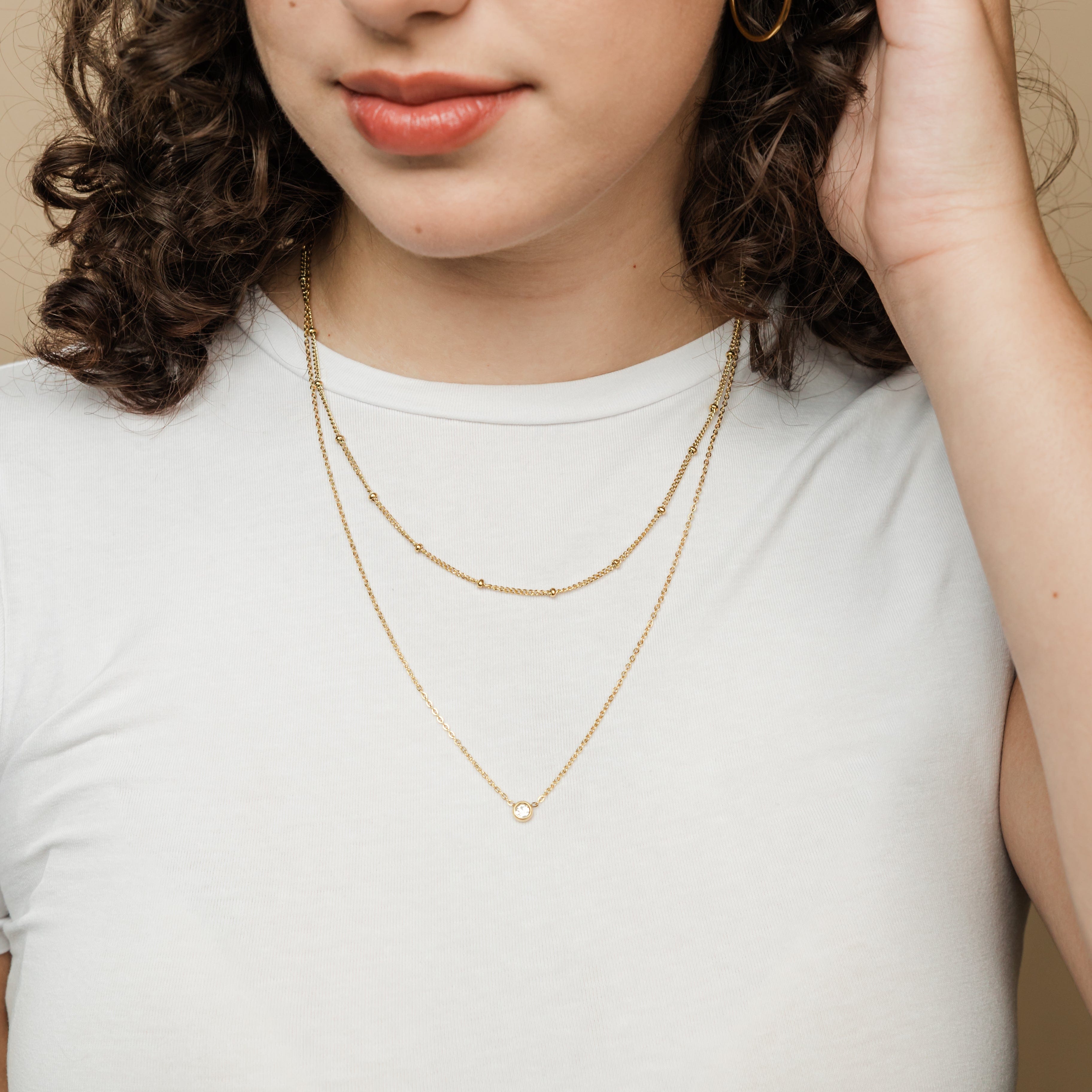 Close-up of the Dotted Chain, highlighting its delicate 2MM thickness and gold finish.
