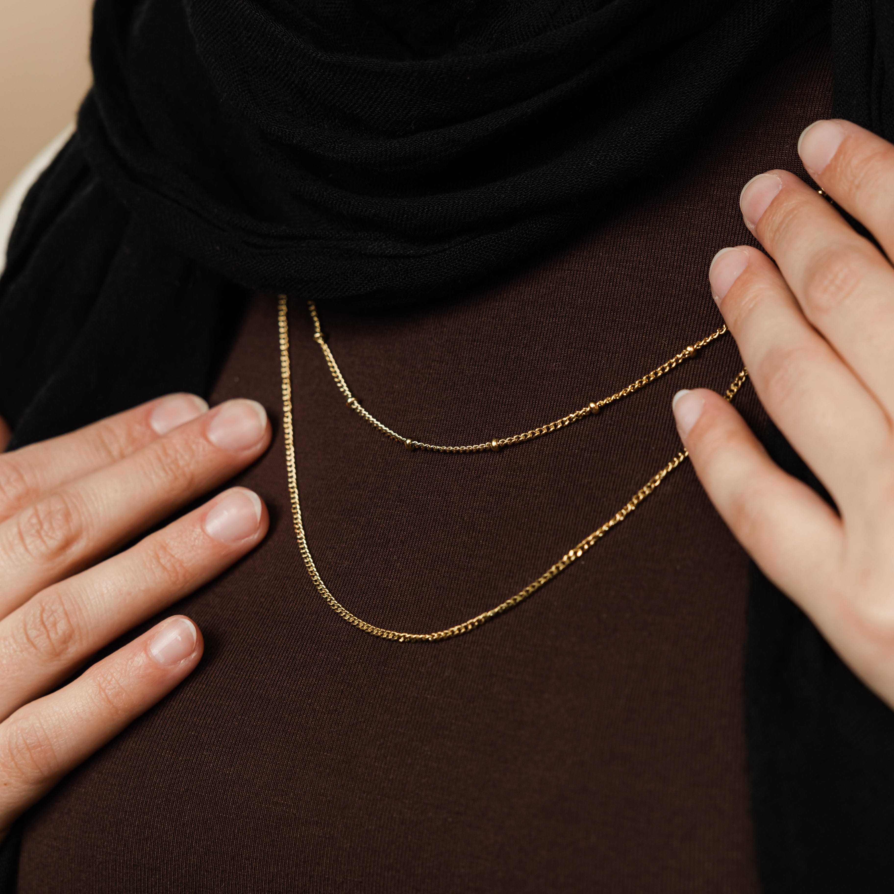 Luna DualGlow™ layering chains styled solo, showcasing gold finish and 2MM width
