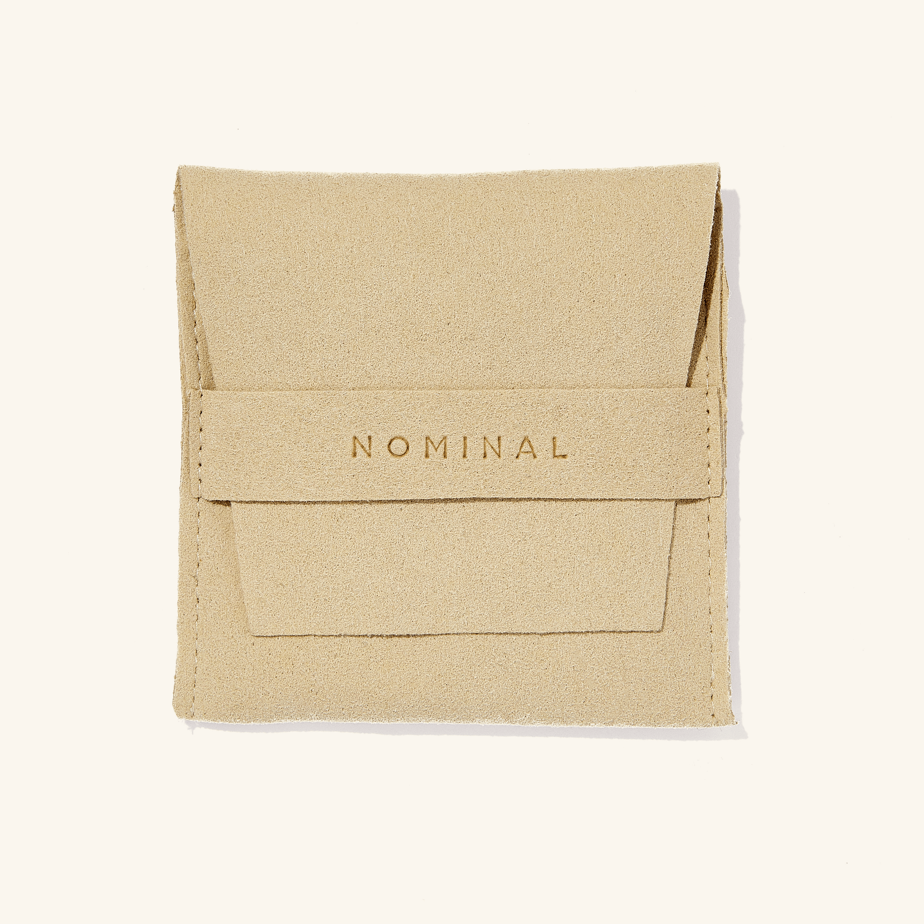 The anklet elegantly packaged in a velvet drawstring pouch, ideal for gifting or personal storage.