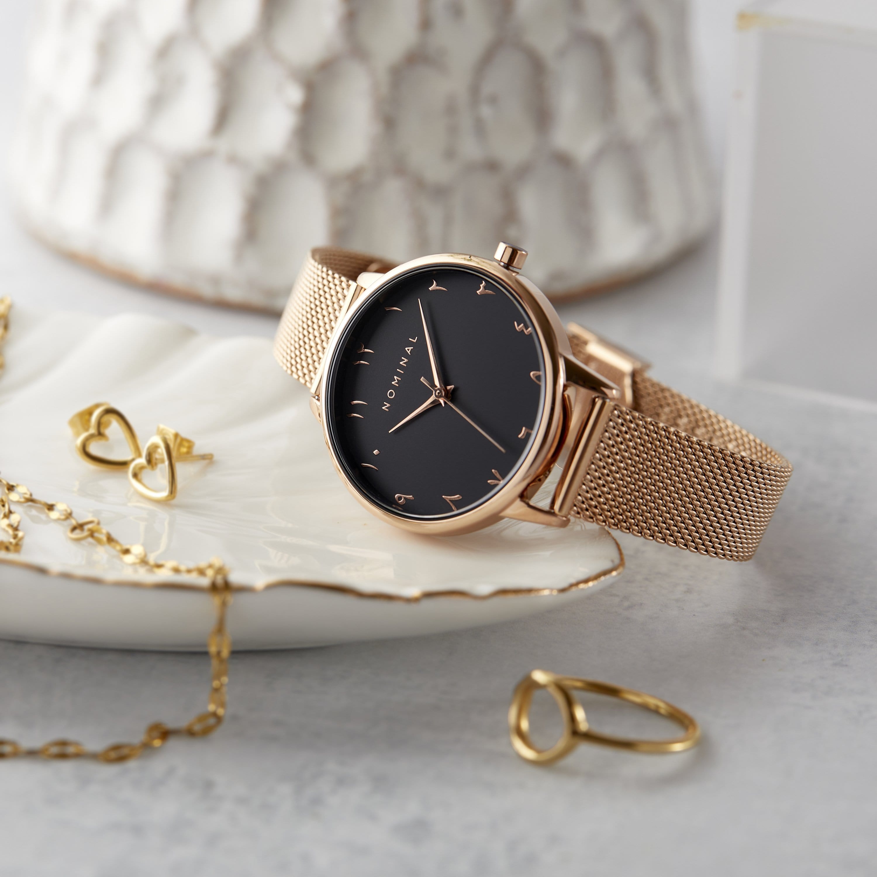 Blossom Elegance Watch side view displaying its stunning rose dial and Arabic numerals.