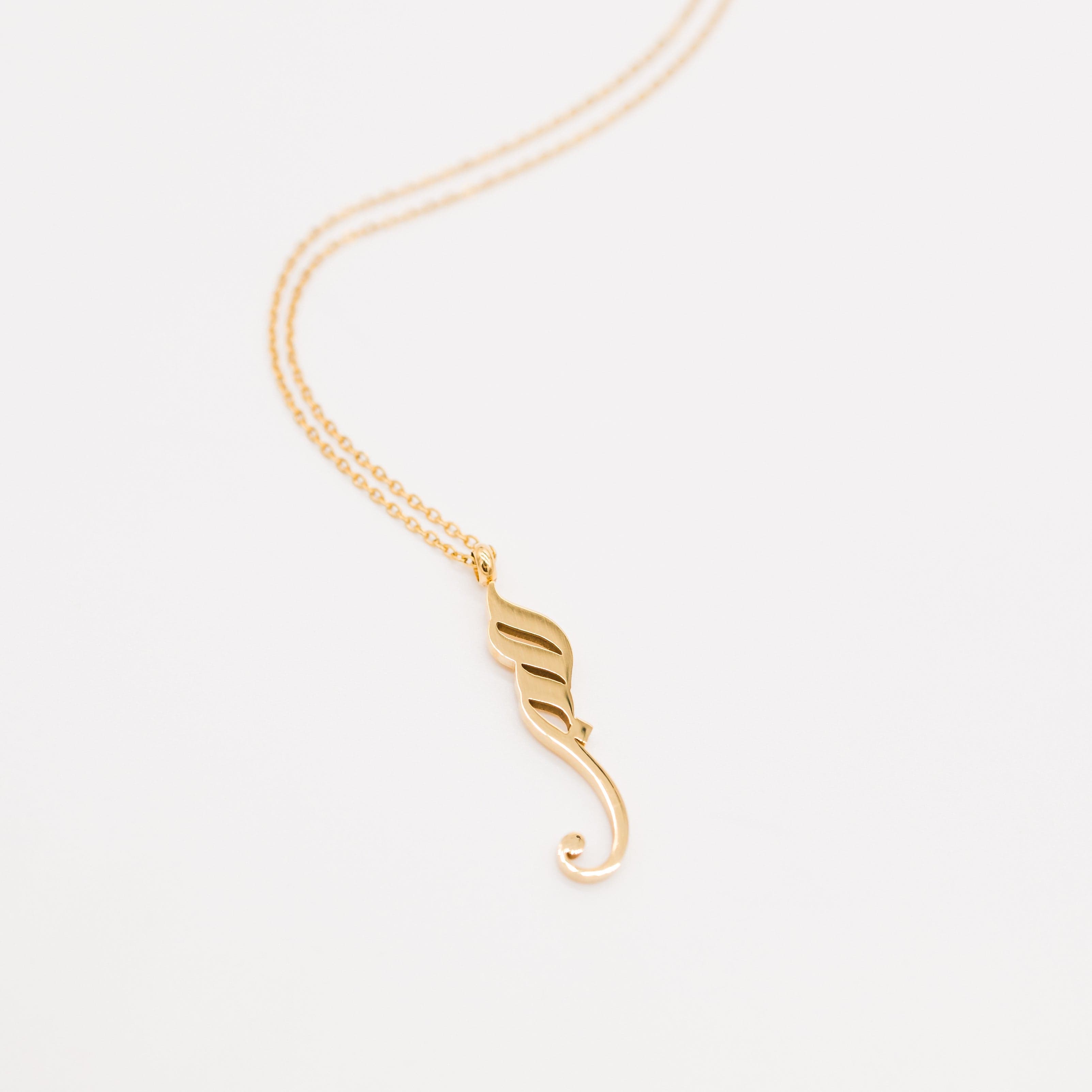 Sabr Calligraphy Necklace showcasing the Arabic word for patience, elegantly displayed on a model.