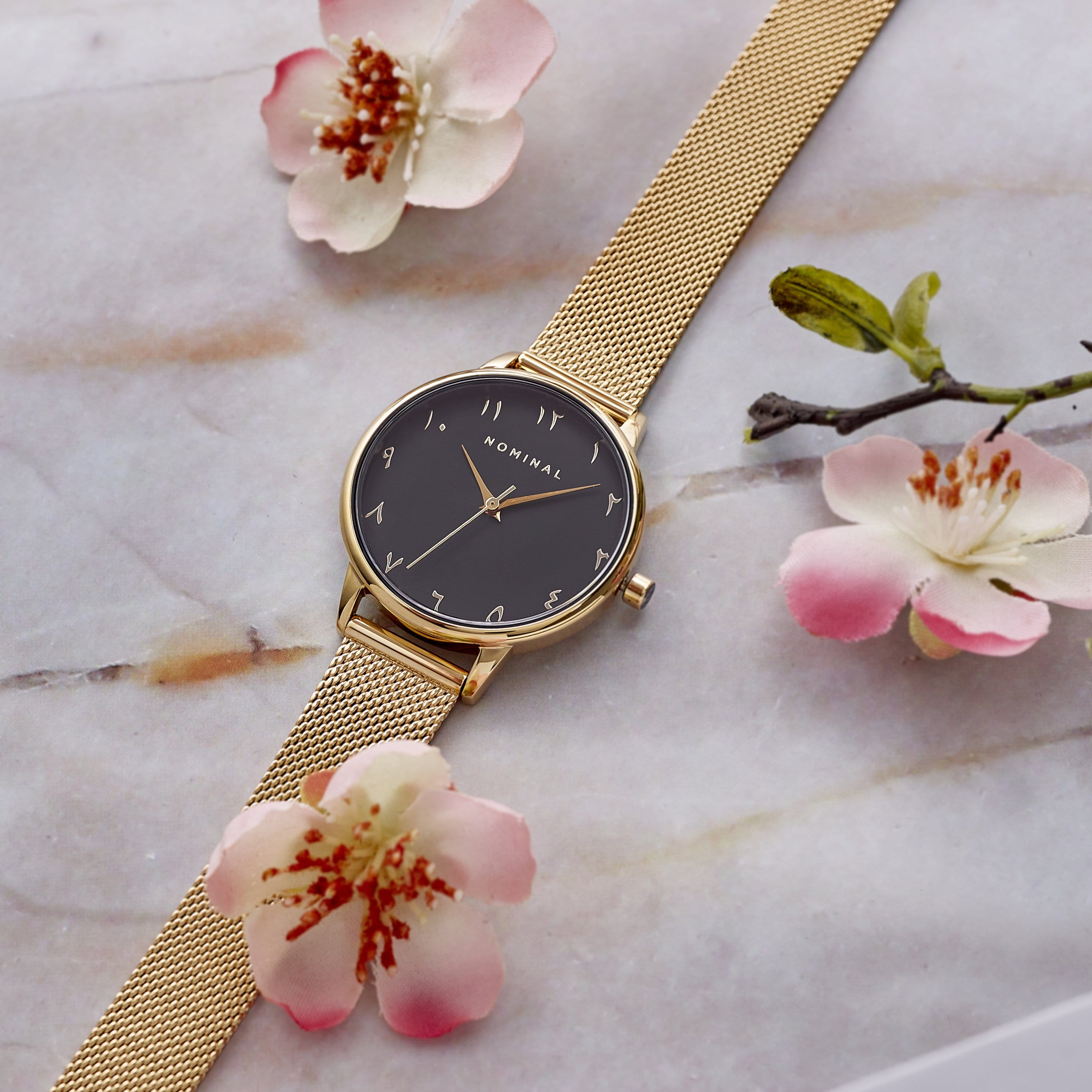 Sunflower Elegance watch showcasing Arabic numerals and sapphire crystal from an angled view.