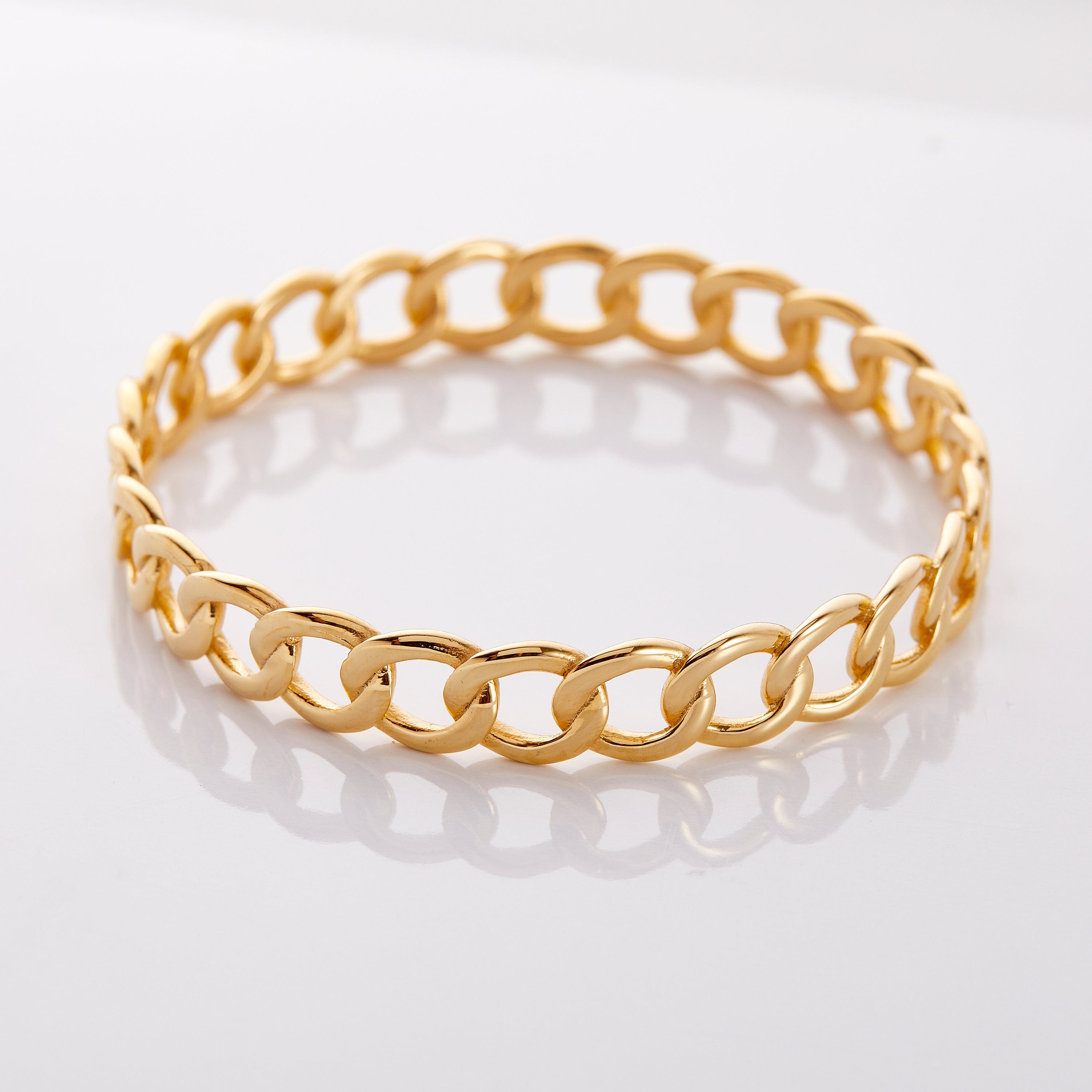 Elegant Interlock Bangle displayed on a model's wrist, showcasing its luxurious design.