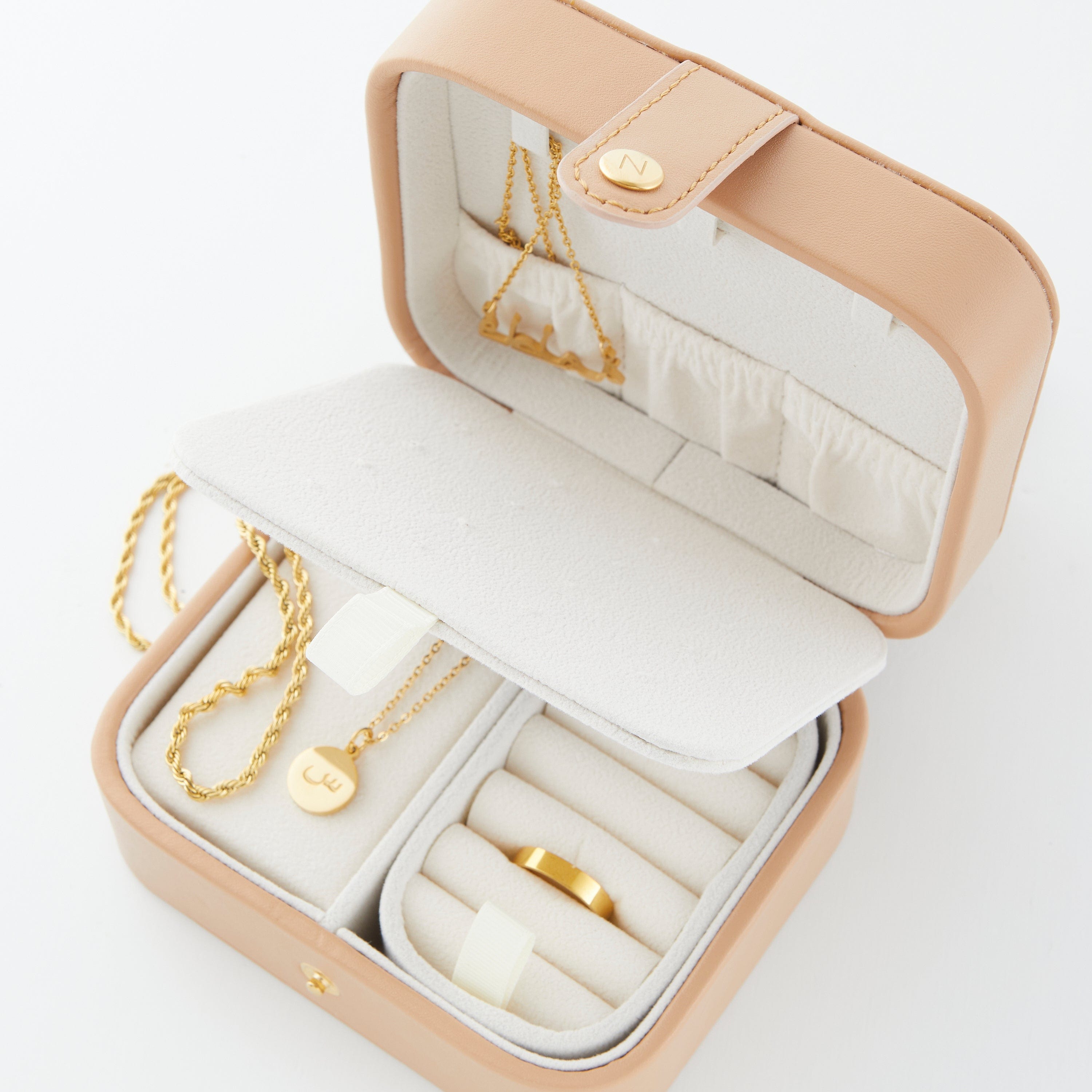 The Journey Travel Jewelry Case opened, displaying three sections for organized accessory storage.