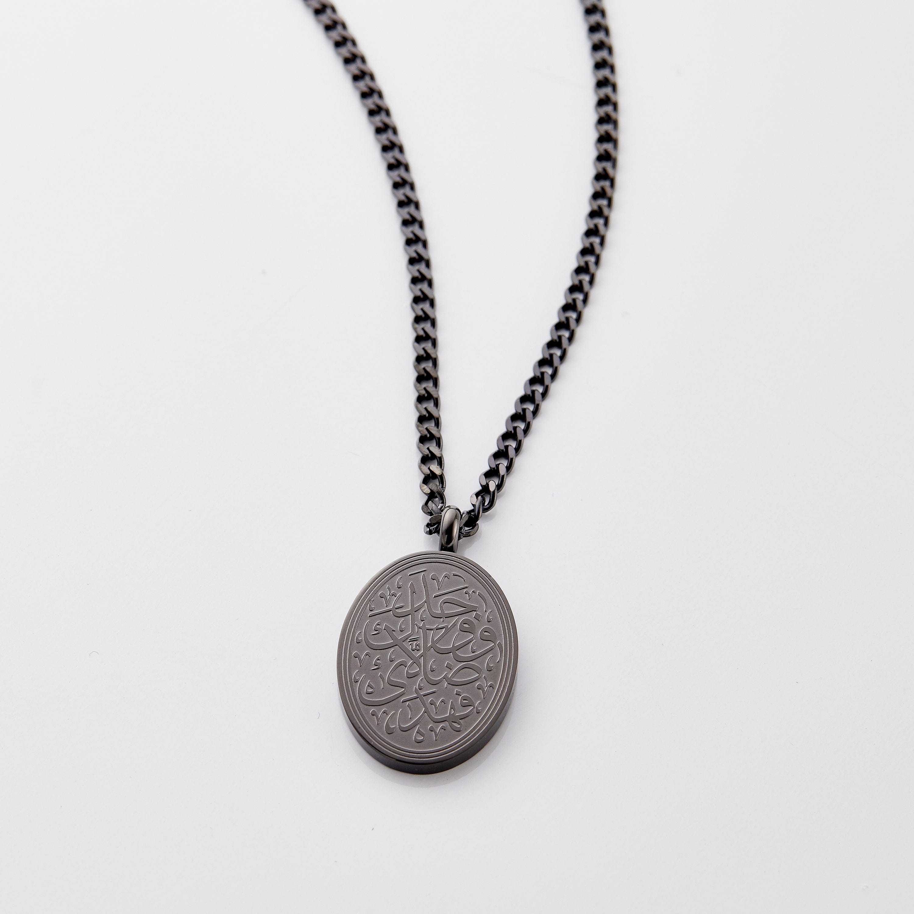Close-up of the personalized men's necklace with verse, showcasing intricate calligraphy.