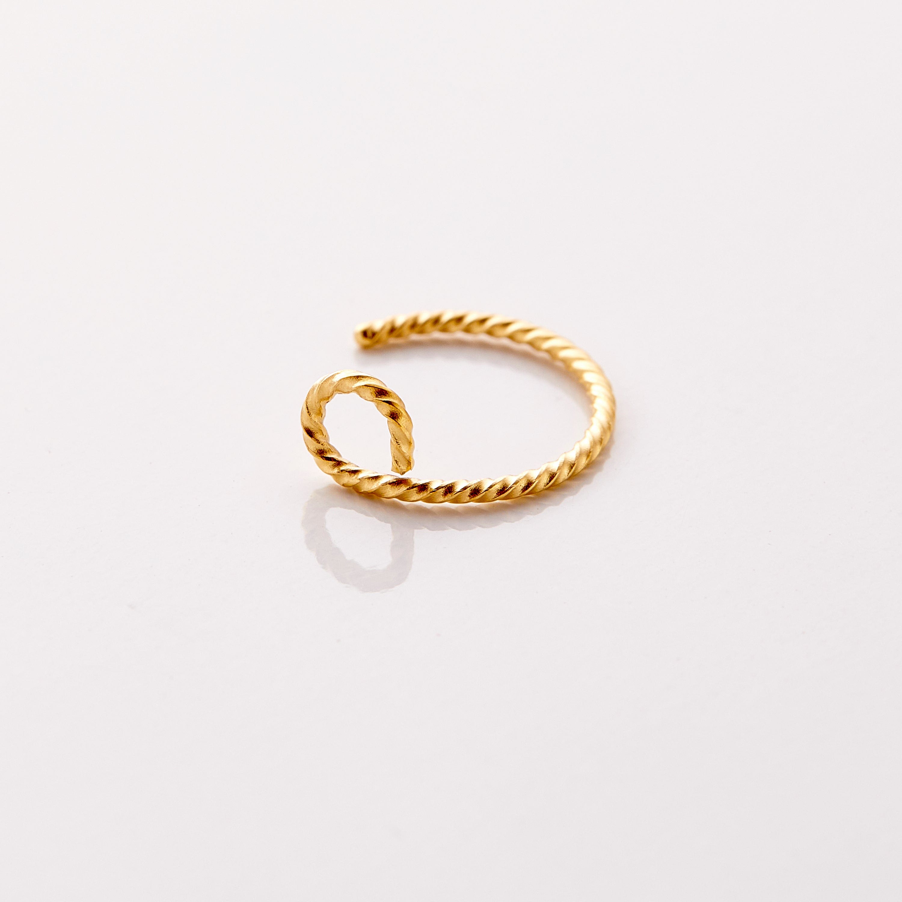 Twisted Elegance faux nose hoop showcasing its unique spiral design.