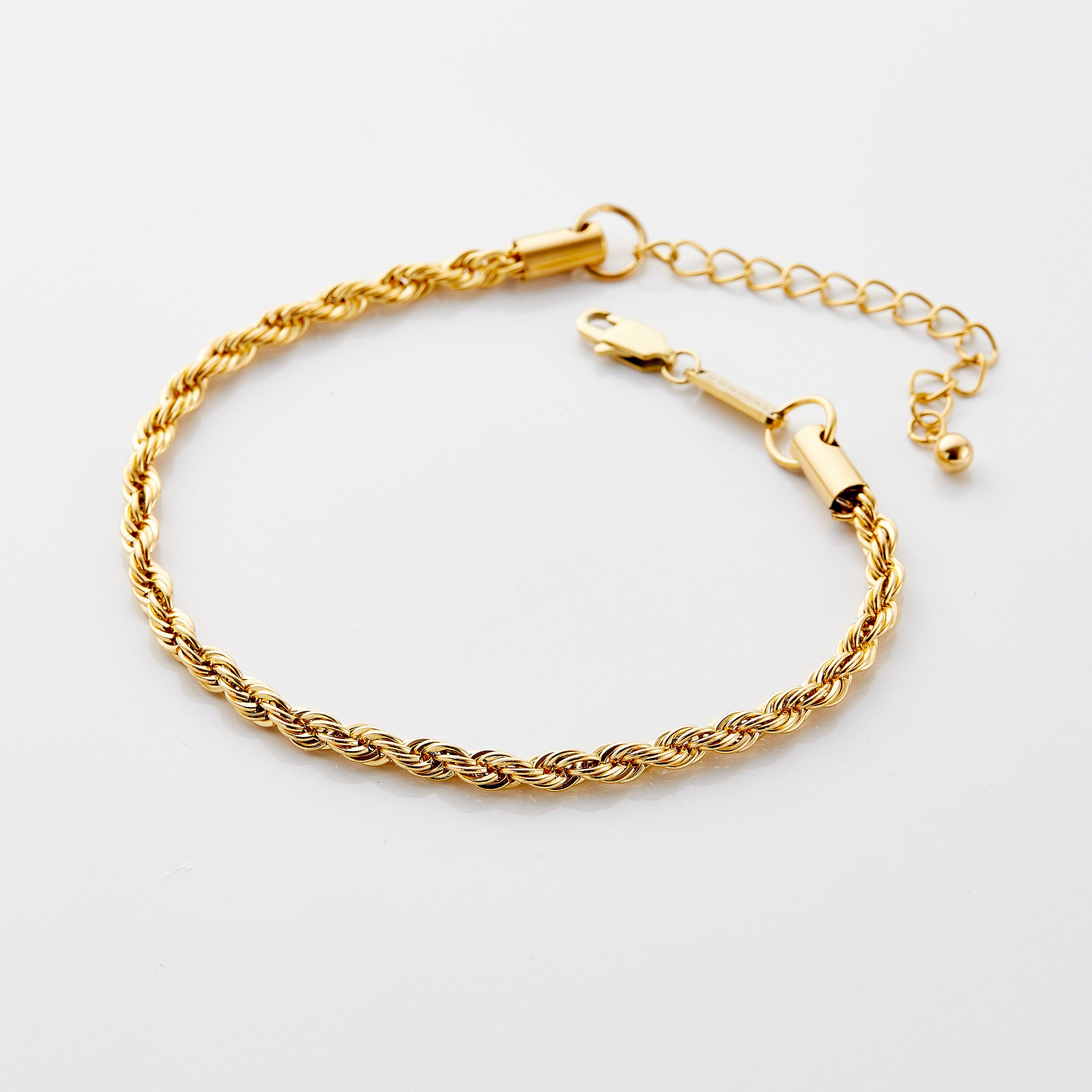 Elegant rope chain anklet displayed on a summer beach setting, highlighting its stylish design.