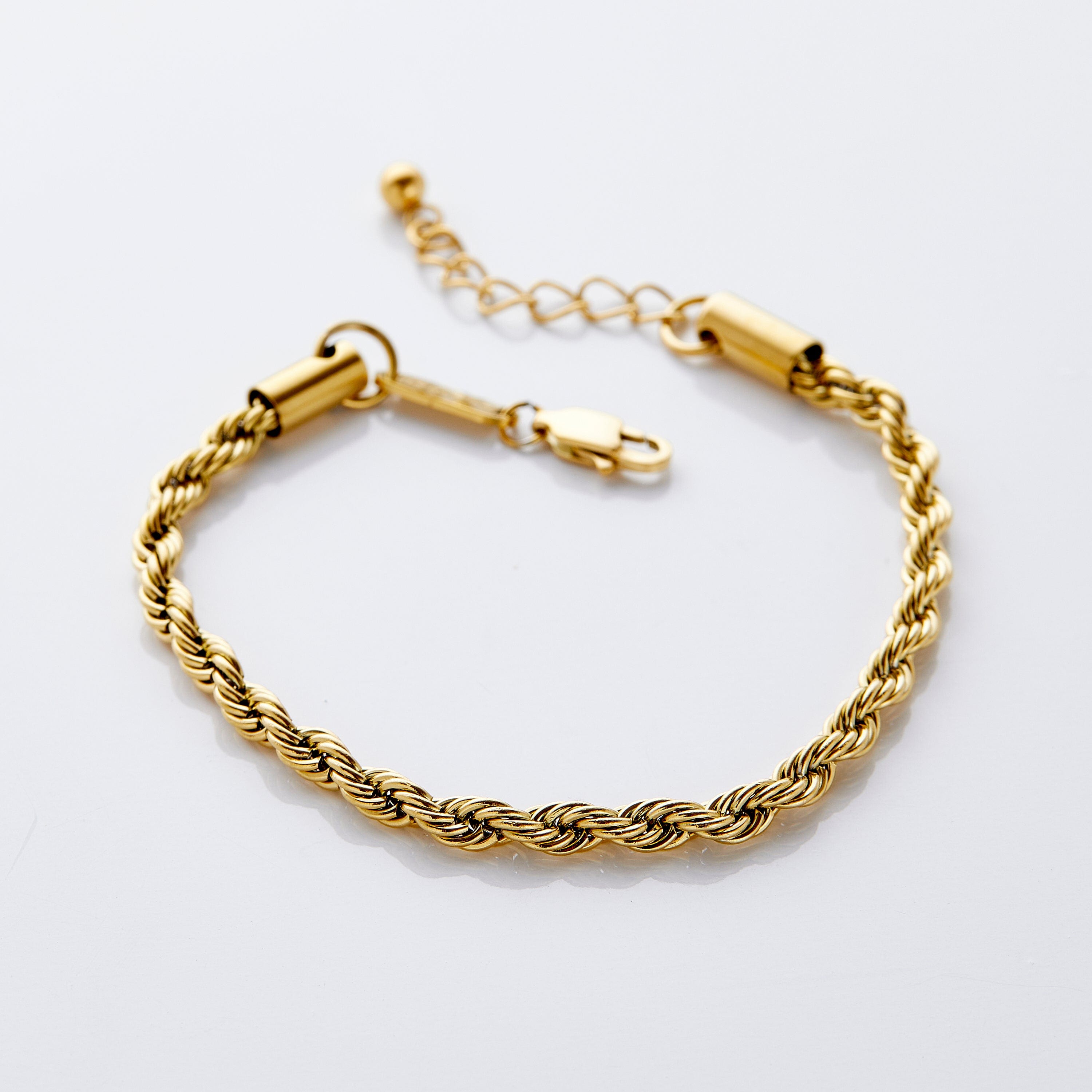 Elegant gold rope bracelet worn by a model showcasing its shine.