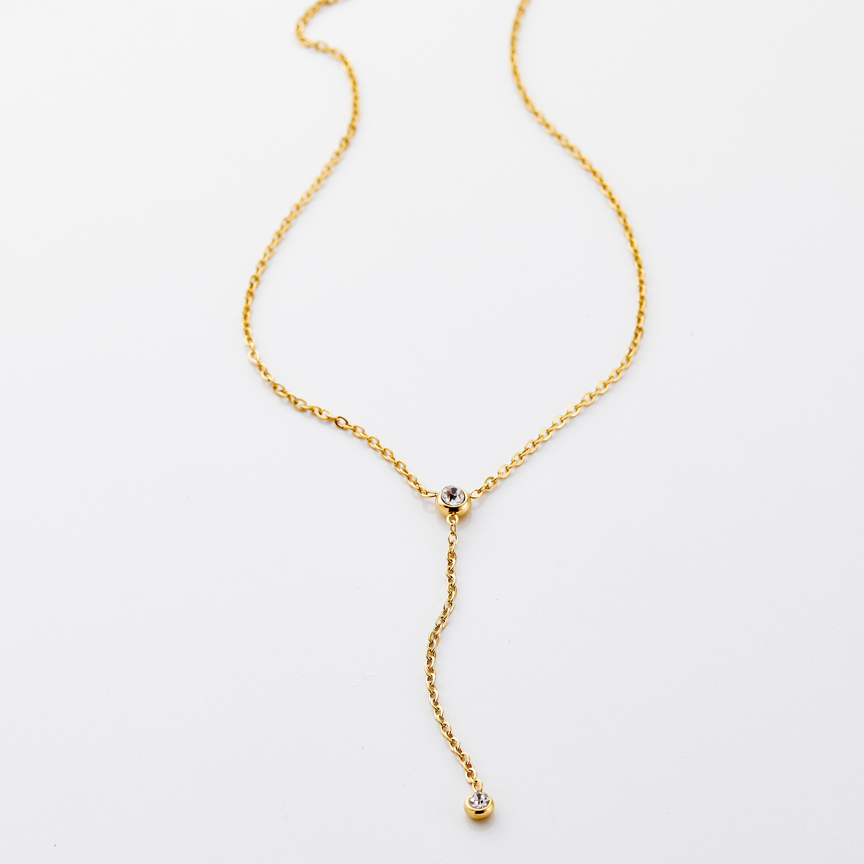 Elegant bezel lariat necklace showcasing the top gemstone detail and chain length.
