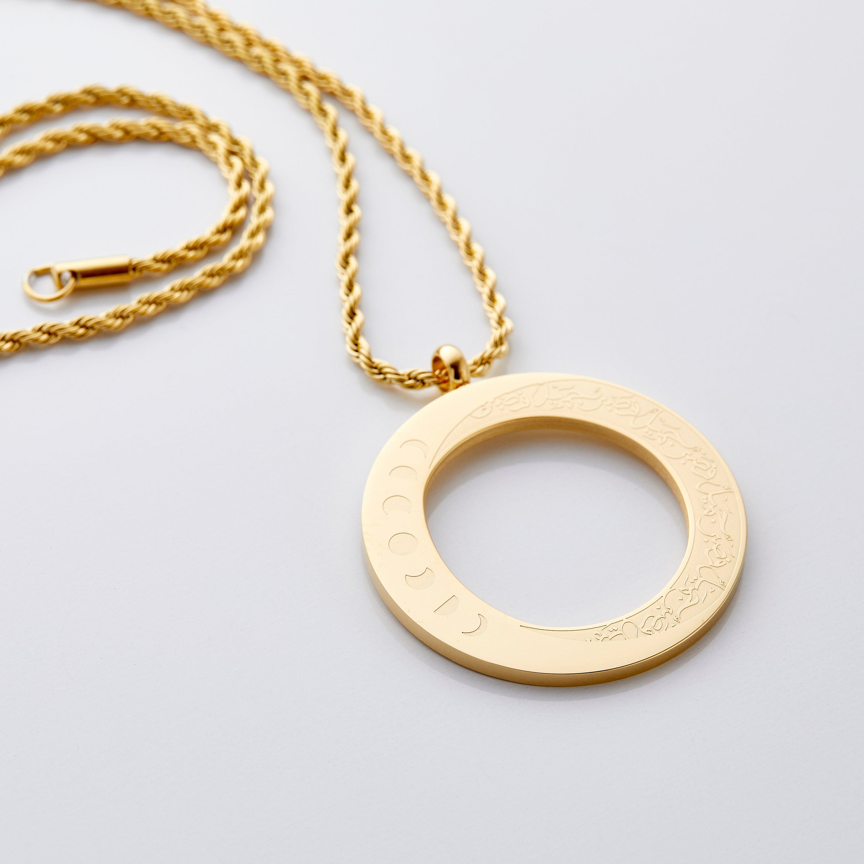 Close-up of the Elegant Patience Moon Pendant Necklace highlighting the engraving.